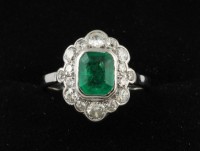 An antiques diamond and emerald cluster ring mounted in platinum (1,000-1,400).