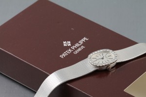 A lady's 18ct white gold, diamond-set watch by Patek Phillipe - it comes from the estate of Costelloe Lodge in Connemara - and is brand new, complete with tags, sleeve and boxes, (3,000 - 5,000).