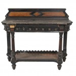 AN AESTHETIC MOVEMENT EBONISED AND STAINED OAK SIDE TABLE, by Lamb of Manchester, (200-400).
