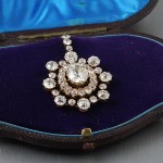 A diamond cluster pendant set with old cut stones.