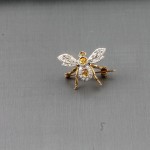 A diamond brooch modelled as a bee (700-800).