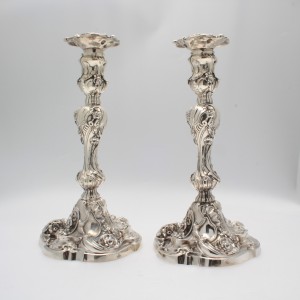 A pair of Rococo Silver candelsticks Dublin 1750 by R.Williams priced 25,000 at Weldons.