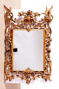 A carved giltwood wall mirror by James Hicks of Dublin (1,000-2,000).