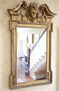 A giltwood wall mirror (2,000-3,000);