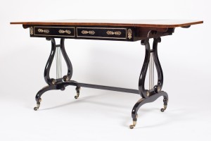 A Regency rosewood crossbanded and inlaid sofa table (3,500-4,500)
