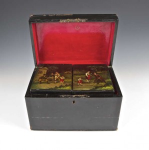 A 19th century Russian lacquered papier-mache tea caddy (1,200-1,800).