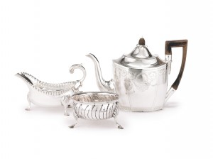 An Irish silver teapot, sauce boat, and sugar bowl, Cork, circa 1780-1800
