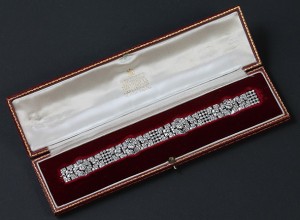 An Art Deco diamond bracelet in original Garrard box (12,000-14,000).