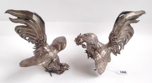 Pair of profusely decorated London silver fighting cocks  (2,800-3,200).