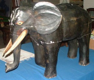 This vintage wooden elephant is estimated at 350-500.