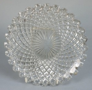 A Waterford Glass plate with notched rim (£50-80).