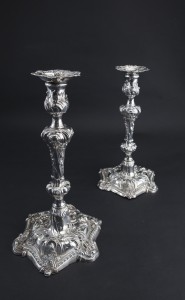 A pair of George II Rococo silver table candlesticks, London 1756, mark of John Cafe.