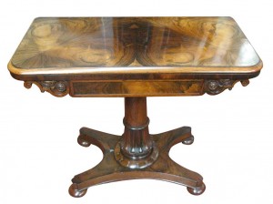 An early 19th century rosewood card table (1,600-2,500)