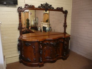 An ornate Victorian sideboard is estimated at 1,000-1,500.