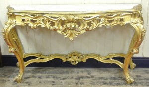 Louis XV style serpentine fronted gilt console table with shaped marble inset (1,400-2,000).