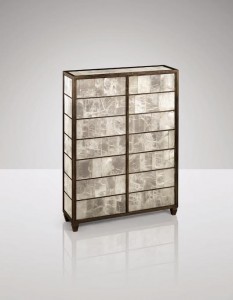 This unique patinated gypsum and bronze cabinet, circa 1935 by Jean-Michel Frank made 3,681,500.