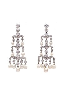 A pair of natural pearl and diamond earrings (6,000-10,000).