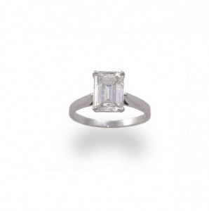 A diamond single-stone ring, composed of a cut-corner emerald-cut diamond within a four-claw setting, to a 14 carat gold hoop, diamond approx. 3.33 carat total (30,000-50,000).