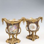 A PAIR OF FRENCH 19TH CENTURY ORMOLU MOUNTED SEVRES PORCELAIN VASES,(2,500-3,500)