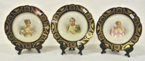 Three Sevres plates decorated with portraits of Napoleon Bonaparte, Josephine and Marie Louise, with borders incorporating the Napoleonic crest.