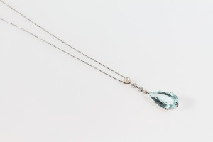 A diamond, pearl and aquamarine pendant (800-1,200)