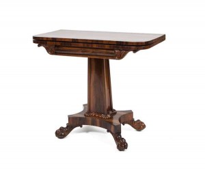 A Victorian rosewood folding tea table (1,500-2,000).