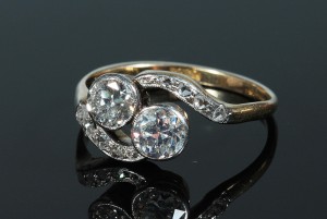 An antique two stone diamond ring (1,000-1,200).