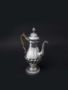AN IRISH PROVINCIAL GEORGE II SILVER COFFEE POT OF BALUSTER FORM, mark of Michael McDermott (fl.1750-1780) of Cork, c.1780 (10,000-15,000)