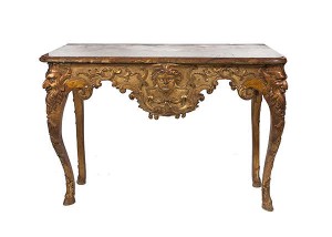 A GEORGE I CARVED GILTWOOD SIDE TABLE IN THE MANNER OF BENJAMIN GOODISON, (30,000-50,000).