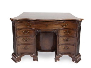 A FINE LATE GEORGE II MAHOGANY SERPENTINE FRONT GENTLEMAN'S WRITING DESK, circa 1755, attributed to William Vile, (25,000-35,000)