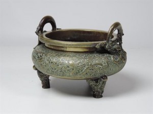 A large Chinese bronze censer with dragon handles sold for 8,200 at hammer.