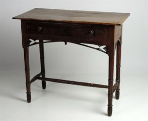 A 19th century small carved oak side table, possibly by Pugin (1,000-1,500).