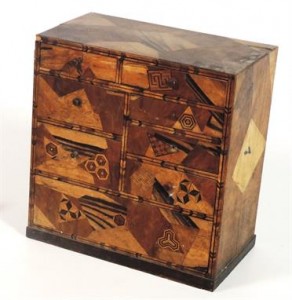 A 19th century table cabinet with eight drawers made of various specimen woods (120-180)