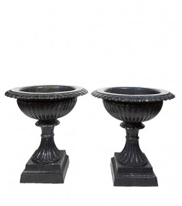 A PAIR OF VICTORIAN BLACK PAINTED CAST IRON GARDEN URNS