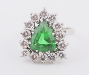 A large triangular emerald and diamond cluster ring (6,000-9,000).