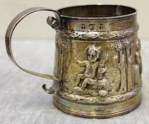 The mug by Charles Begheagle, repousse chased with children representing the Four Seasons.
