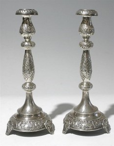 A pair of early 20th century silver candlesticks (150-200).