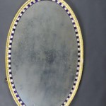 A large Irish George III oval wal mirror with blue and gilt enriched glass studs (3,000-4,000)
