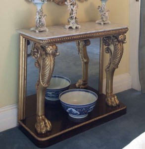 An Irish George III carved gilt wood and rosewood console table (4,000-6,000).