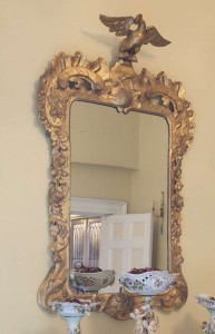 An Irish George II gilt wood mirror with later carved eagle (6,000-10,000).