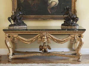 A carved gilt wood side table in the manner of Matthias Locke, Kent (20,000-30,000).