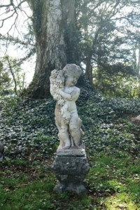 A 19th century Italian sculpted stone cherub (1,400-1,800).
