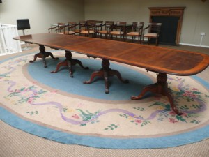 A Dun Emer Guild rug, circa 1950,  made originally for Aghadoe House, Killarney (500-1,000). The reproduction table in the image has a similar estimate.