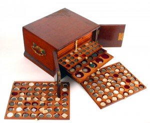The small mahogany coin box.