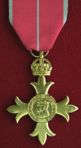 The OBE awarded to the catholic chaplain.