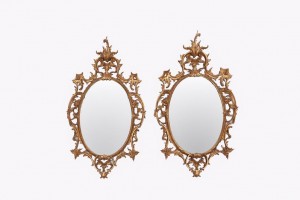  Late 19th century oval carved gilt-wood mirrors. English.