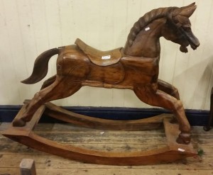A carved rocking horse  (400-500).