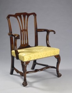 One of a pair of Irish 18th century armchairs at Olympia.