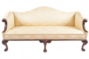 An Irish George II walnut and upholstered settee at Sheppards on December 1.