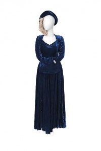 Margaret Thatcher’s Wedding outfit comprising Mrs Thatcher’s midnight blue velvet wedding dress, with a sweetheart neckline and long sleeves, labelled Constance Gowns and Suits, Old Bexley; a blue velvet soft brimmed cap with a curled pink ostrich feather and a blue velvet muff, with an Art Deco double clip silver and marcasite brooch (£10,000-15,000).
